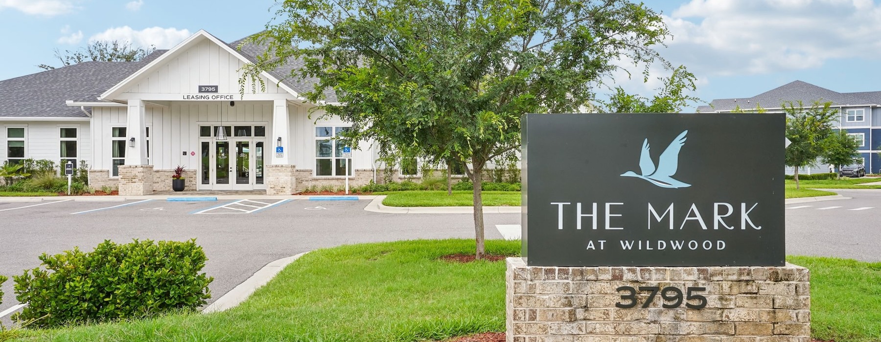 a sign in front of a building