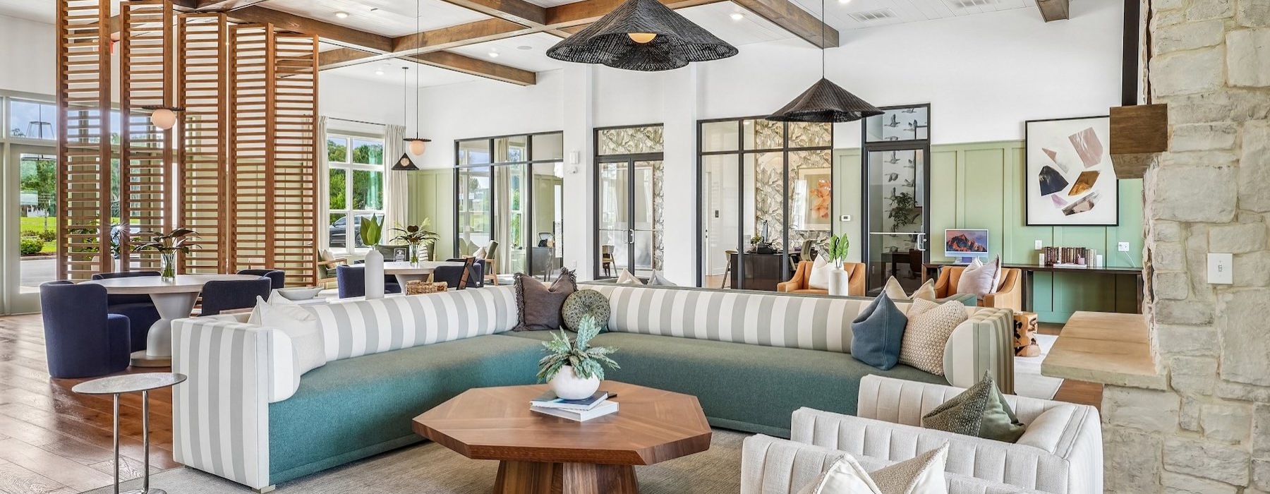 a clubroom with tables, chairs and a couch