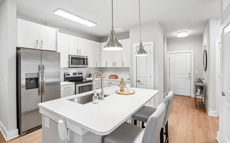 a kitchen with white cabinets